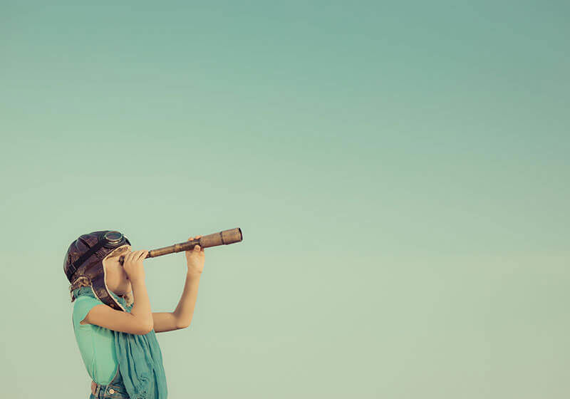 Girl looking through telescope