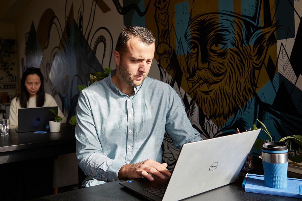 Scott Rowe working on a laptop