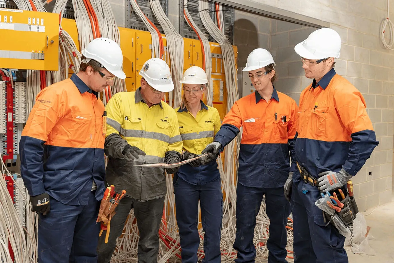 electrical-workers-talking-over-plans.jpg