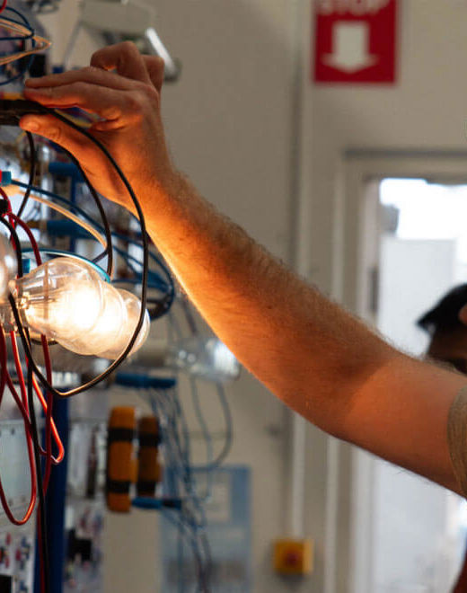 Male training to be an electrician by wiring